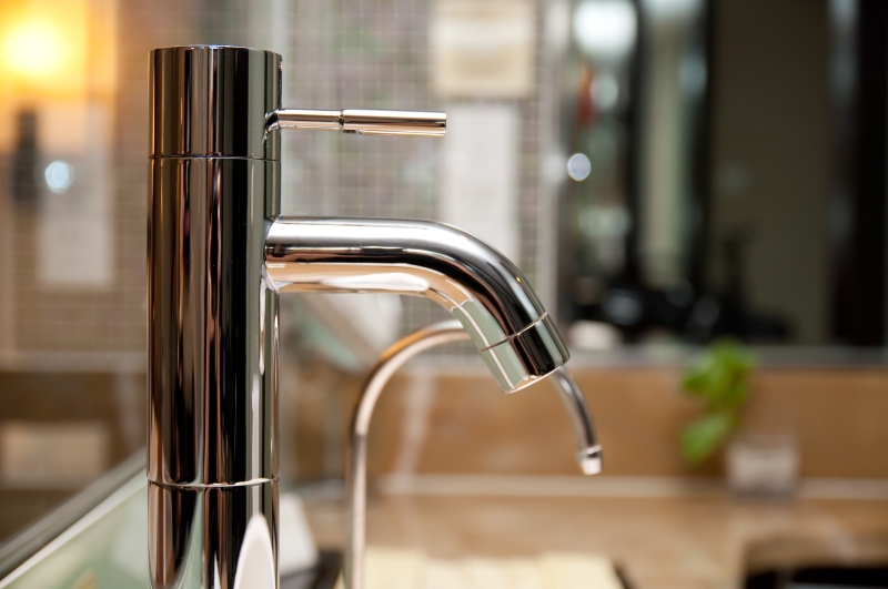 Leaking tap being repaired in Pimlico